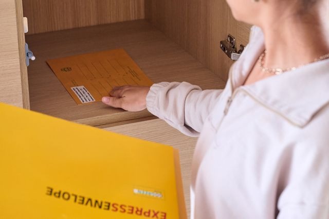 person picking up mail.