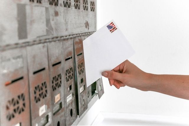 person picking up mail.person picking up mail