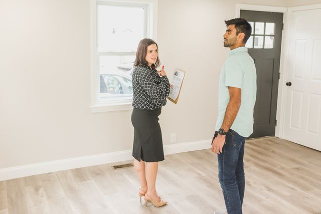 Landlord and tenant inspecting a rental unit