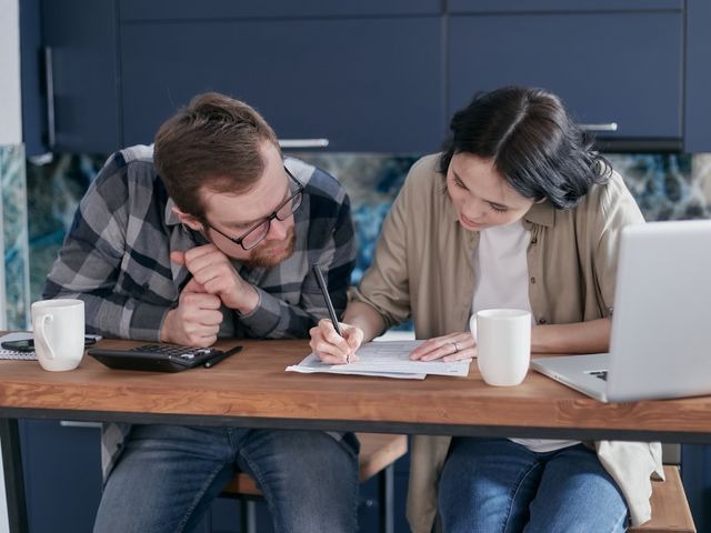 property manager and landlord calculating rental amount