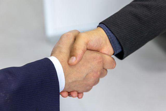 landlord shaking hands with a landlord