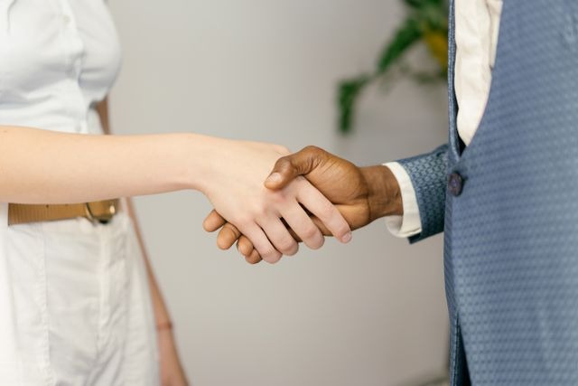 property manager and landlord shaking hands